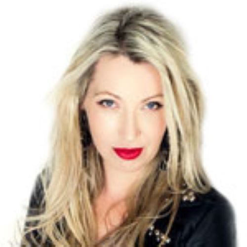 A headshot image of Kylie Ryan smiling at the camera. She is wearing a black shirt. She has long blonde hair and bright red lipstick.