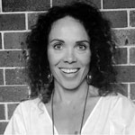 Black and white headshot of Laura Washington, smiling.