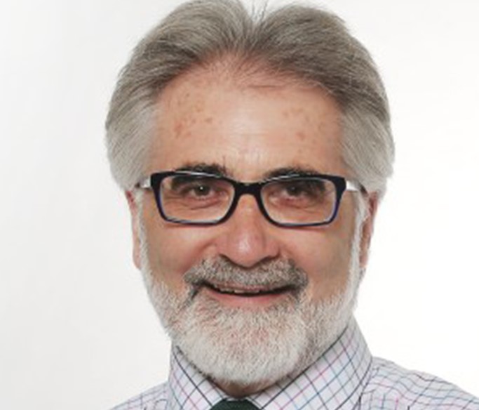 This image is a headshot of Danny O’Connor, smiling at the camera.