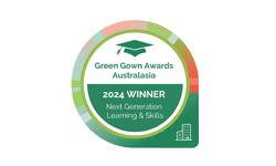 Circular Green Gown Awards Australasia badge featuring a graduation cap icon, “2024 WINNER” text on a green background, and “Next Generation Learning & Skills” with a building icon, representing sustainability excellence in education.