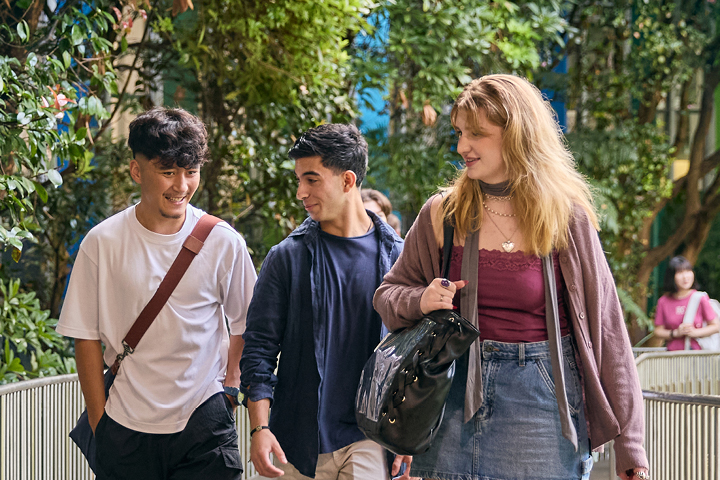 Students walking campus path