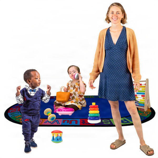A woman and two children in a playroom with toys.