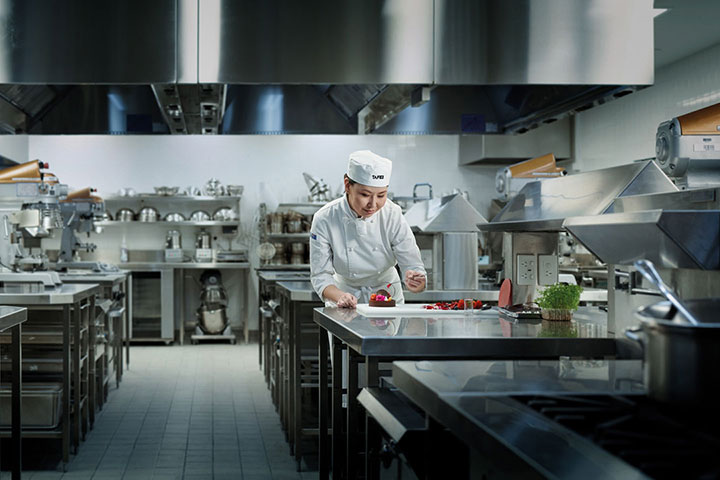 Female student chef working on her desert